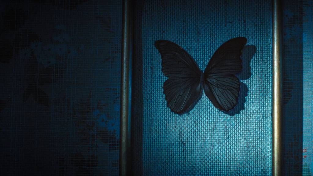 Niels Arestrup as Albert talking intensely to a ghostwriter in a dimly lit room in Black Butterflies