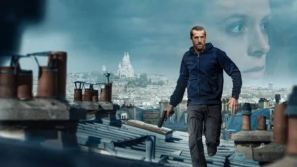 Guillaume Canet holding a weapon in a dark action sequence from the French film Ad Vitam