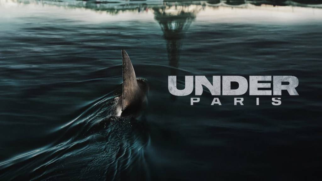 A tense underwater scene showing the dark silhouette of a massive shark in the River Seine from Under Paris